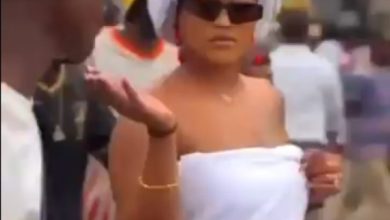 Photo of Outrage, shock as Lagos lady arrives busy bus-stop in towel