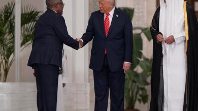 Photo of Dangote, Trump exchange pleasantries during high-profile visit to Qatar