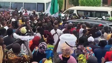 Photo of Supporters march with Natasha to celebrate unsealing of her office